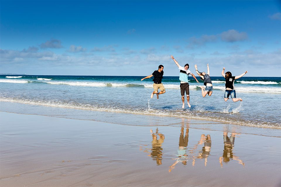 beach-jump-water-fun-hi-five-wet-portrait-group-family-lorne-bluesky-infocus-photography