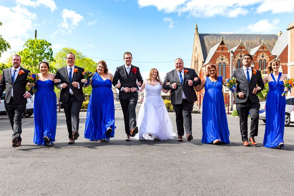 wedding-bridal-party-holding-hands-group-bride-groom-marriage-love-guys-girls-infocus-photography